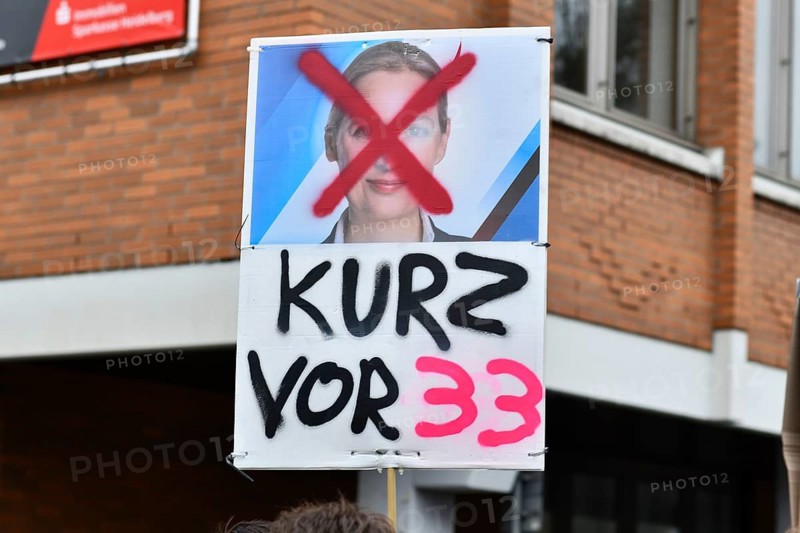 Heidelberg, Germany - February 12th 2025: Anti Afd politican Alice Weidel sign at protest against far-right extremism
