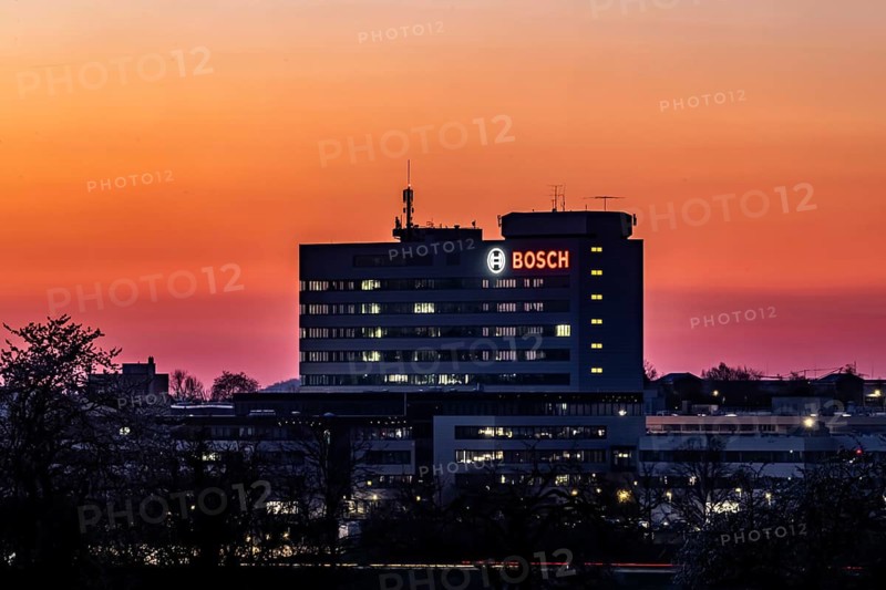 Bosch factory at sunset. Illuminated logo of the company. Schwieberdingen, Baden-Württemberg, Germany