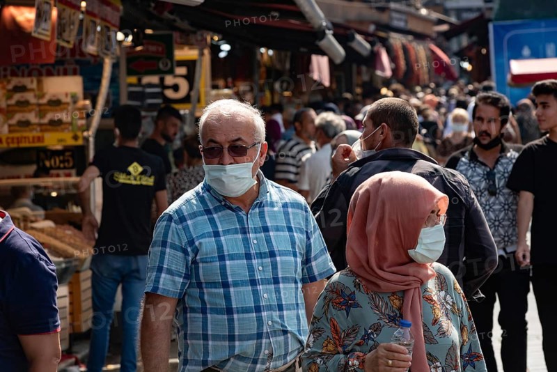 Istanbul, Turkey 25th August 2021 A Turkish couple wearing protective face masks in a busy market in Istanbul, Turkey during the Covid-19 Pandemic