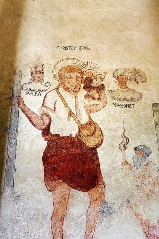 Historical fresco, wall painting, Pope, St. Christopher and Mohammed, Saint Christopher carrying the baby Jesus across the river, interior view of the medieval church of Gothem, Gothem Kyrka, east coast, island of Gotland, Sweden