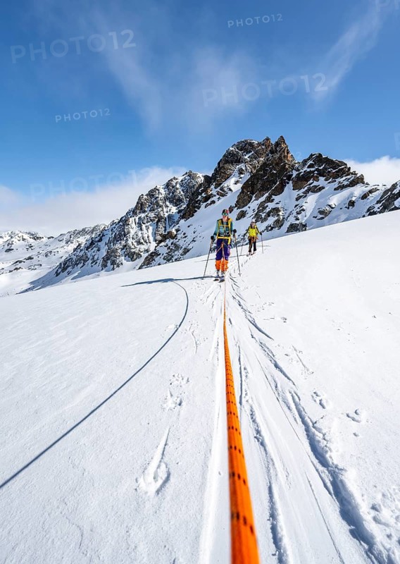 Ski tourer with rope, rope team on the Vadret da Porchabella glacier on the ascent to the summit of Piz Kesch, mountain landscape in winter, alpine tour, ski tour Bündner Haute Route, Albula Alps, Rhaetian Alps, Grisons, Eastern Switzerland, Switzerland