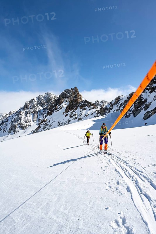 Ski tourer with rope, rope team on the Vadret da Porchabella glacier on the ascent to the summit of Piz Kesch, mountain landscape in winter, alpine tour, ski tour Bündner Haute Route, Albula Alps, Rhaetian Alps, Grisons, Eastern Switzerland, Switzerland