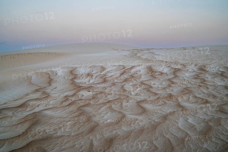 Sunset, white sand dunes in the Khaluf desert, Oman