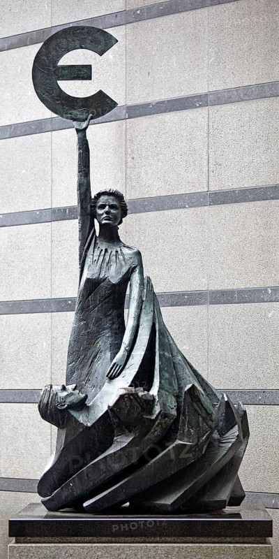 The bronze statue entitled Europe by May Claerhout holds up the euro symbol, Rue Wiertz, European Parliament, Brussels