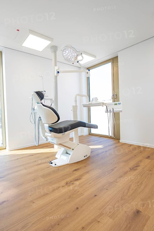 Bright dental practice with a modern dental chair and wooden floor, dentist, medical center at the Calw health campus, Germany