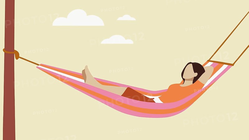 A woman with long hair lounges in a vibrant hammock, enjoying a peaceful afternoon. She appears relaxed and carefree in a serene outdoor setting