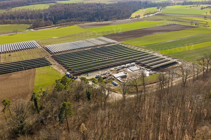 Solar system in a rural area, from above with surrounding fields and trees, Agri PV Bau für Landwirtschaft, Enzkreis, Germany