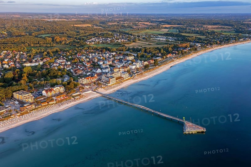 Aerial view over Seebrücke, pier and sandy beach at seaside resort Scharbeutz along the Baltic Sea, Ostholstein, Schleswig-Holstein, Germany