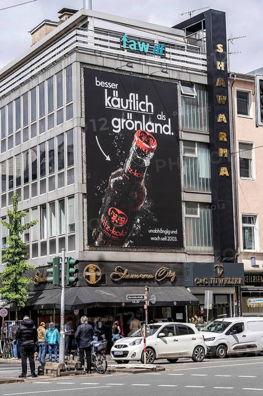 Large-format advert for Fritz-Kola, an independent Hamburg-based cola and lemonade producer, alluding to Donald Trump's intention to buy Greenland, Oststraße in Düsseldorf, North Rhine-Westphalia, Germany