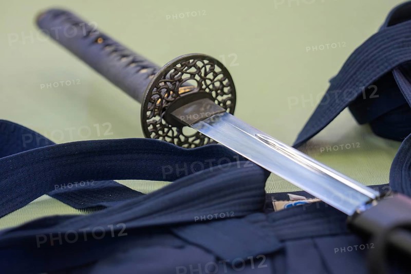 A katana lies on a kimono used for traditional Japanese martial arts, Aikaido, Calw, Germany