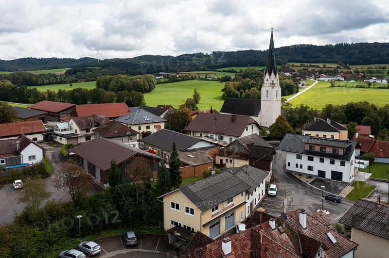 Drone shot, view of village with church, Sankt Marienkirchen am Hausruck, Hausruckviertel, Upper Austria, Austria