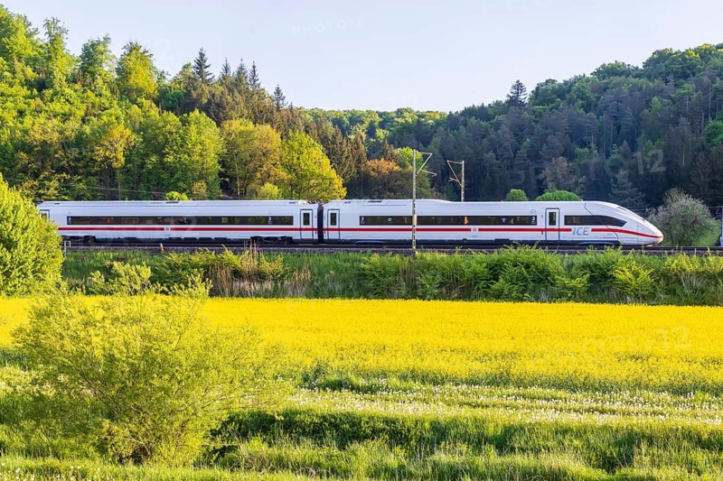 InterCityExpress ICE travelling across the Swabian Alb. Idyllic landscape in spring. Lonsee, Baden-Württemberg, Germany