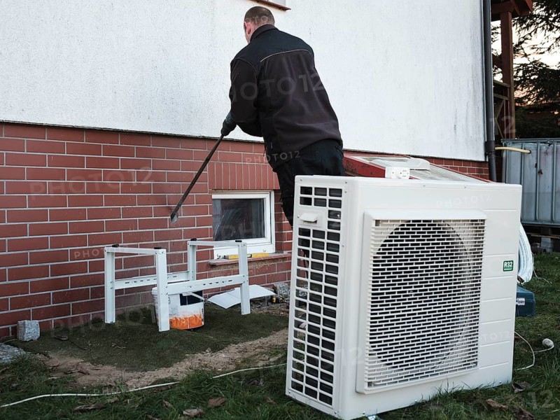 The installer installs the heat pump in a single-family house in Tymowa, Poland