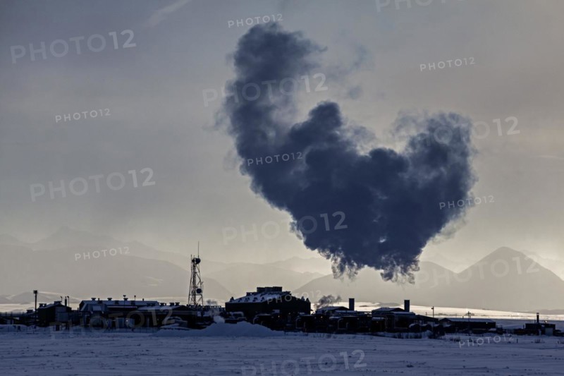 Oil pumping station backlit, oil production, winter, North Slope, Alaska, USA