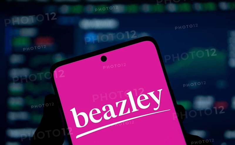 Beazley logo is displayed on smartphone. Beazley plc is the British parent company of specialist insurance businesses with operations in Europe.