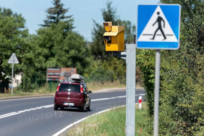 Speed camera and pedestrian crossing road sign