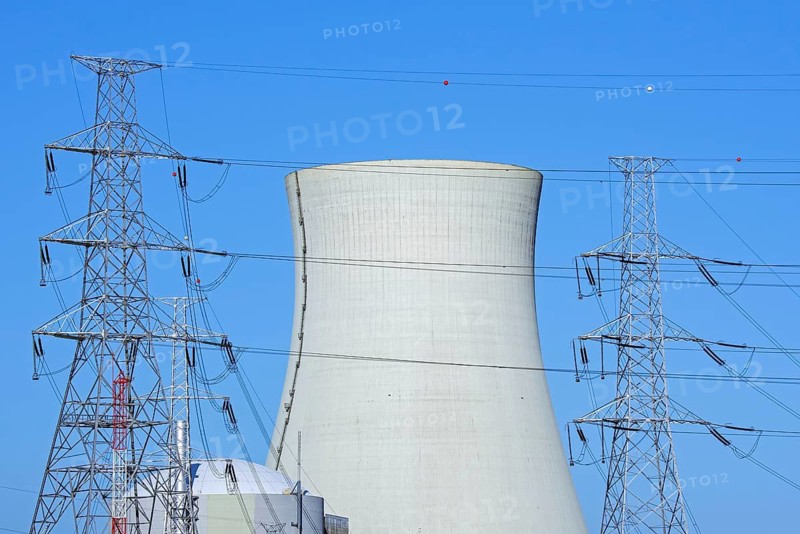 Cooling tower of the Doel Nuclear Power Station, nuclear power plant and high-voltage electricity pylons in the Antwerp harbour, Flanders, Belgium