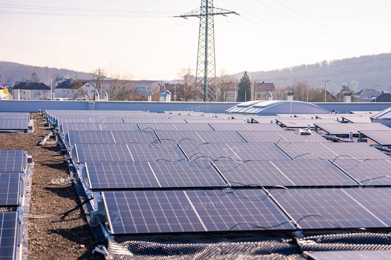 Extensive view of a roof installation with solar panels in an urban area, PV installation at OBI Baumarkt, Mühlacker, Enzkreis, Germany