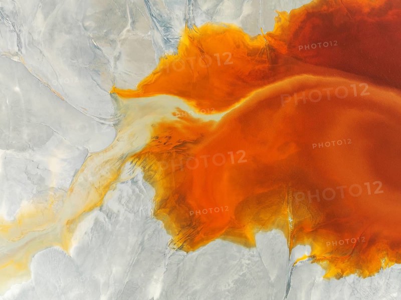 Waste pond in the mineral-rich area of the Rio Tinto mines. The colour is caused by oxidised iron minerals. Aerial view. Drone shot. Huelva province, Andalusia, Spain