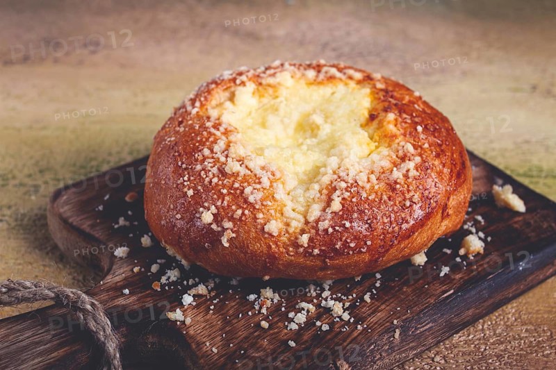 Bun with cottage cheese, pastries, cheesecake, no people
