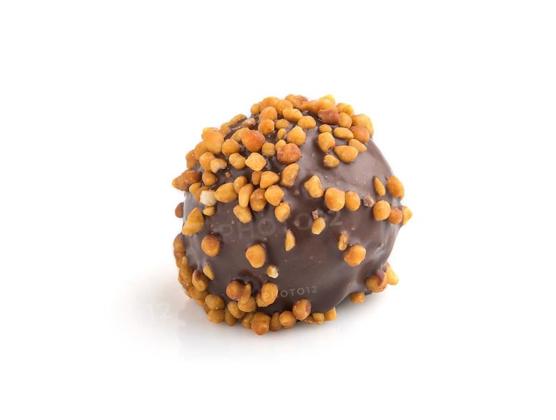 Chocolate caramel ball candy with almonds isolated on white background. Side view, close up
