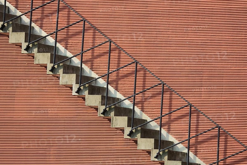 Staircase at the portico, red house façade with stairs and railing, linear fine geometric structure, patterns, lines, shadows, steps, detail, modern building, Main Island, Frankfurt am Main, Hesse, Germany