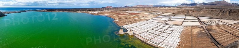 Salt mining plant, Salinas de Janubio with green Laguna de Janubio, near Yaiza, aerial view, Lanzarote, Canary Islands, Spain