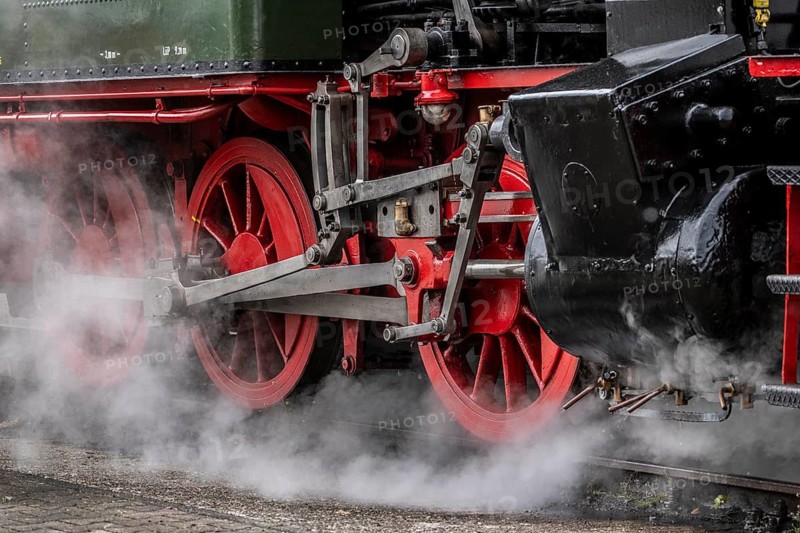Detailed view of the drive wheels and coupling rods of a steam locomotive, Bochum railway museum, museum days weekend, with many attractions such as steam locomotive rides, 3 locomotives are under steam, historic trains make round trips through the Ruhr Valley, many locomotives can be visited, on the site of the former Dahlhausen railway depot, North Rhine-Westphalia, Germany