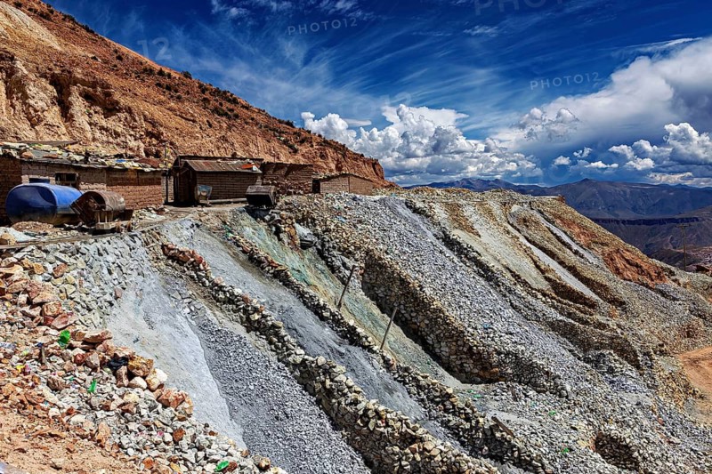 Dramatic rock formations rise to the sky along a dry landscape, the silver mines near Potosi on Cerro Rico in Bolivia