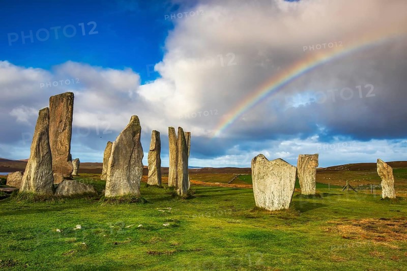 The Calanais Standing Stones are an extraordinary cross-shaped setting of stones, located on the Isle of Lewis in the Outer Hebrides, Scotland. They were erected 5, 000 years ago, predating England's famous Stonehenge, and served as an important site for ritual activity for at least 2, 000 years