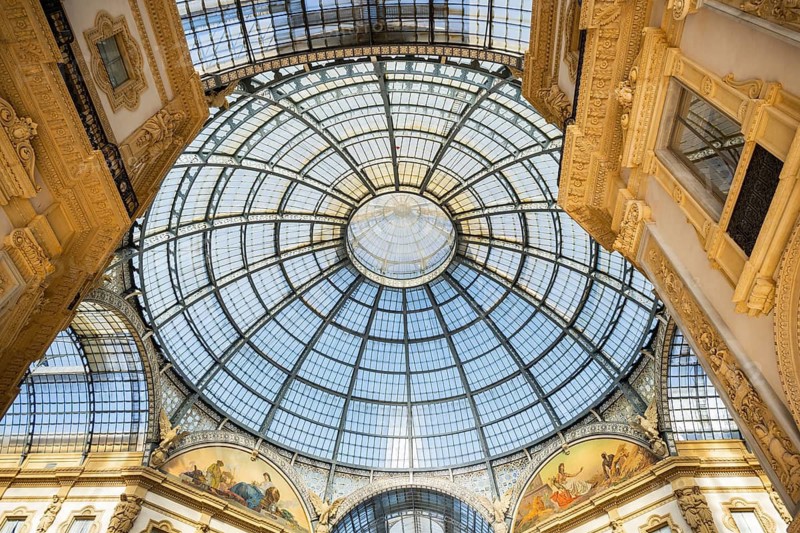 View of the Galleria Vittorio Emanuele with its many luxury shops in Milan on a sunny day, Milan, Italy