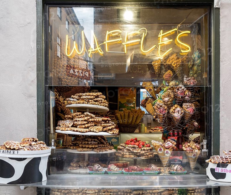 Shop window full of waffles and sweets at Västerlånggatan in the old town Gamla Stan in Stockholm, Sweden