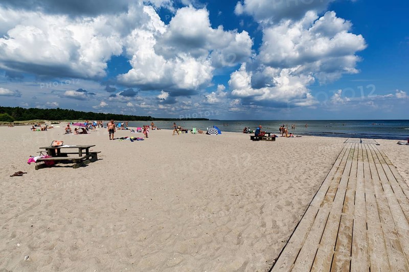 Wide sandy beach with tourists, family beach in summer, Cumulus, coastline, east coast, Baltic Sea, island of Gotland, Sweden