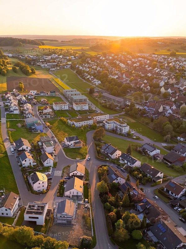 Aerial view of a village with houses, fields and trees at sunset, Gechingen, Black Forest, Germany