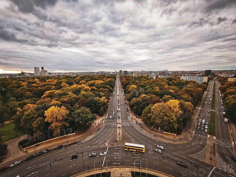 An impressive panorama of Berlin with an autumn avenue and cloudy sky, view from the Victory Column, Berlin