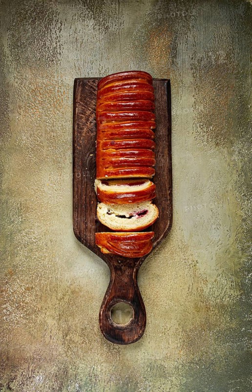 Sweet braided roll, stuffed with jam and raisins, pastries, sweet bread with filling, sweet pie, no people