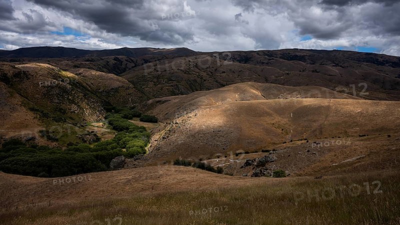 Landscape in New Zealand. View from Lindis Pass Tarras Road towards Cluden Creek Road. Lindis Valley, Otago, South Island, New Zealand