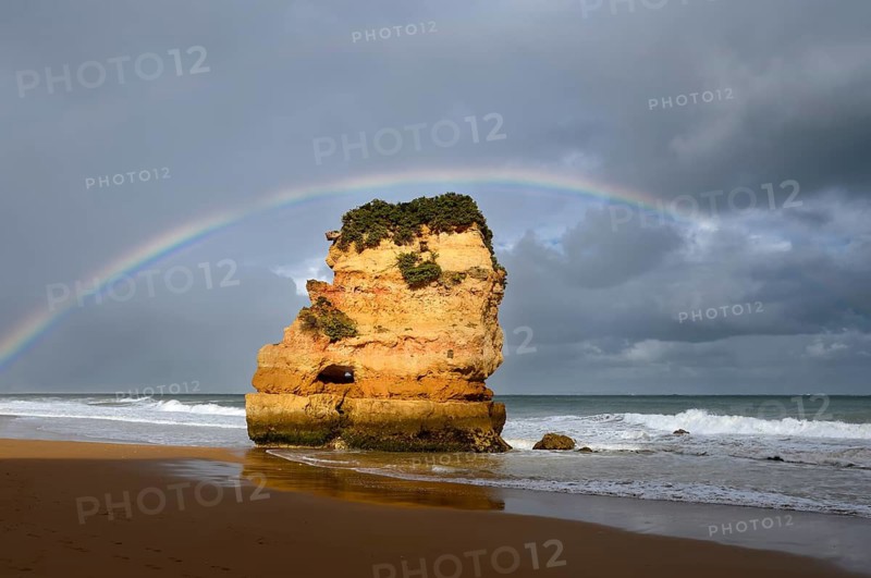 Rocks on beach with rainbow, Praia Dona Ana, Lagos, Algarve, Portugal