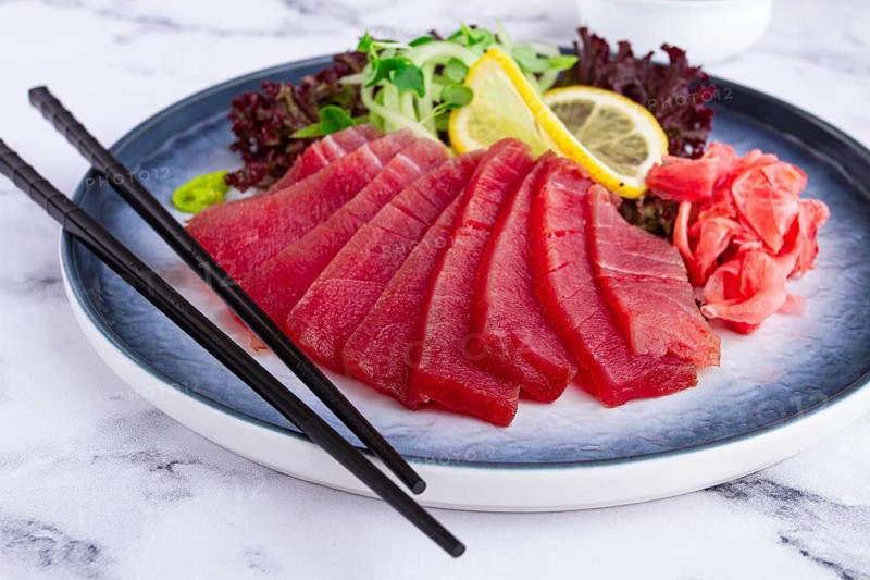 Tuna sashimi, with side dish, on a marble table, homemade, no people