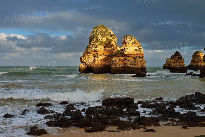 Rock formations on the coast in the evening light, Praia do Camilo, Lagos, Algarve, Portugal