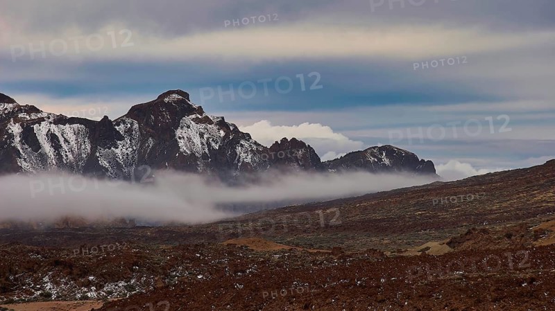 Caldera, mountain landscape with clouds, fog and snowy peaks under a blue sky, Teide, Parque Nacional del Teide, Teide National Park, volcano, volcanism, UNESCO World Heritage Site, Tenerife, Canary Islands, Spain