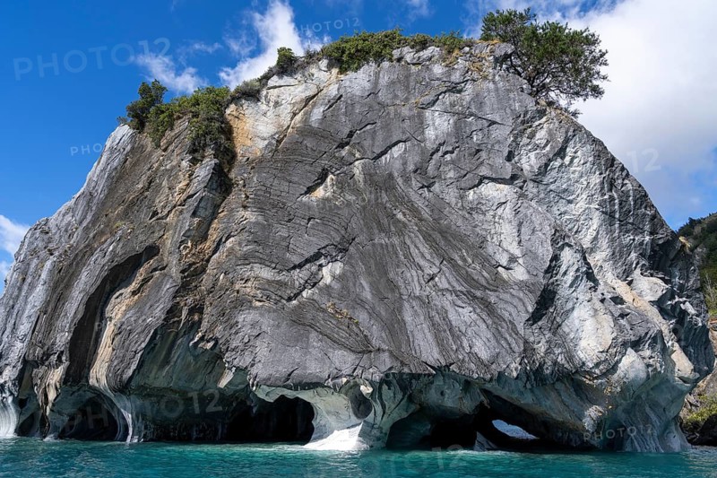 Marble rocks with washed out caves over turquoise water, Capillas de Mármol, Lago General Carrera, Aysén Region, Chile