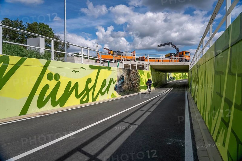 New bicycle tunnel at the junction of the B51 and Warendorfer Straße, in Münster, a bicycle and pedestrian tunnel, 150 metres long, 5.50 metres wide, crosses under the busy roads so that cyclists and pedestrians can pass without crossing, route to and from Münster city centre, visually designed with local motifs as murals, by Lackaffen.de, modern bicycle infrastructure, North Rhine-Westphalia, Germany