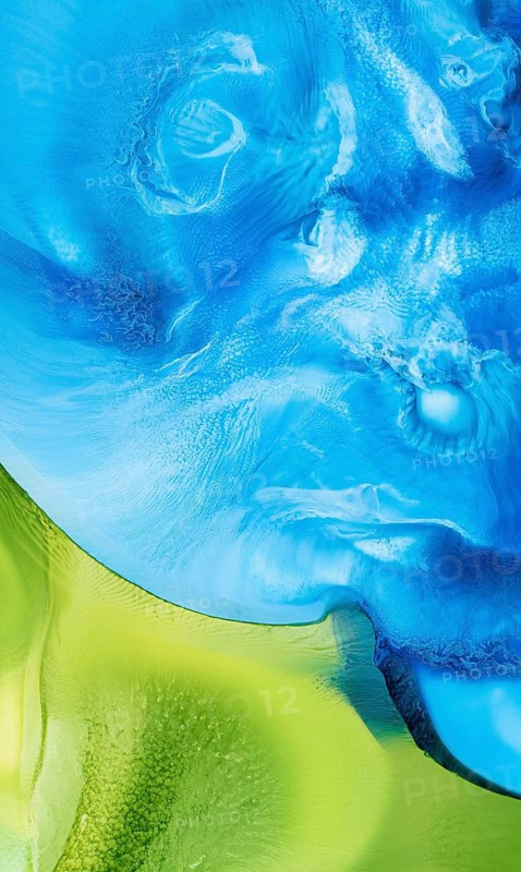 A vivid and dynamic abstract image showcasing swirling liquid inks in rich shades of blue and vibrant green. The organic flow and textural details create an enticing visual blend