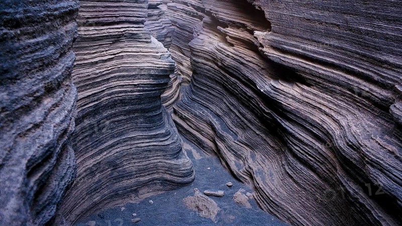 Image showcases the intricate layers and textures of volcanic rocks within Lanzarote Island, highlighting natural geological beauty