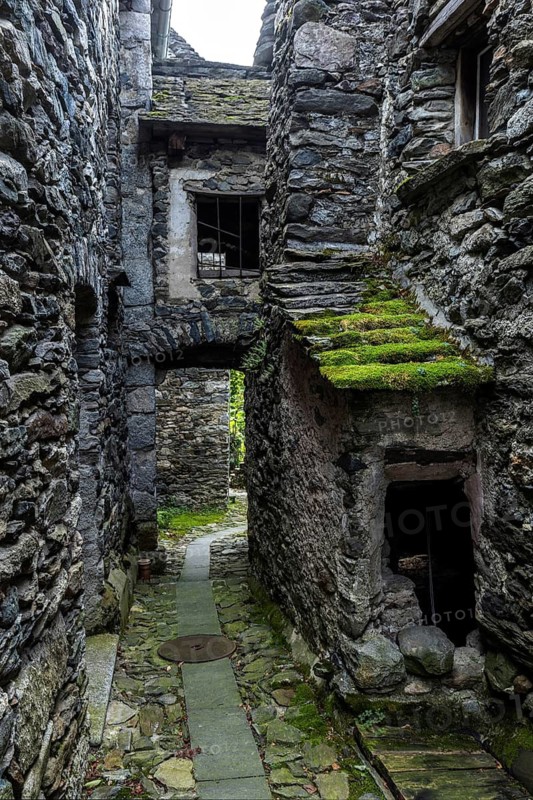 Typical Ticino stone houses in a narrow alley in the mountain village of Bordei, Centovalli, Canton Ticino, Switzerland
