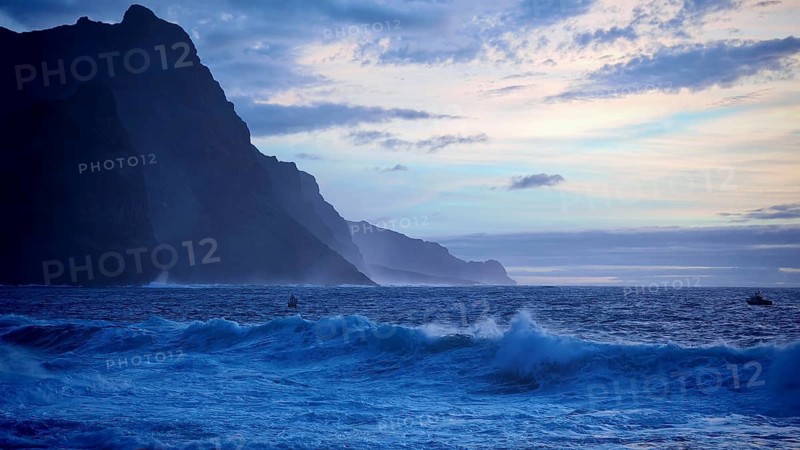 Evening at sea with cliffs, blue sky and waves in a cool atmosphere, dramatic silhouette of mountains, Ponta do Sol, Santo Antao, Cabo Verde, Cape Verde, Cape Verde
