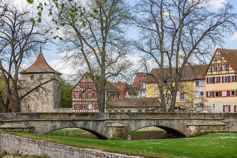 Steinerner Steg. Ensemble of buildings on the Kocher with grass trees. City view of Schwäbisch Hall, Baden-Württemberg, Germany