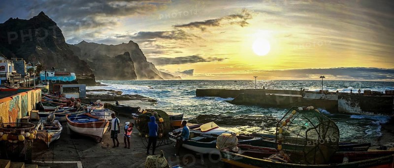 Panorama, people and fishing boats, fishing basket, on the rugged coastline at sunset, graffiti on the wall, romantic harbor scene, Ponta do Sol, Santo Antao, Cabo Verde, Cape Verde, Cape Verde
