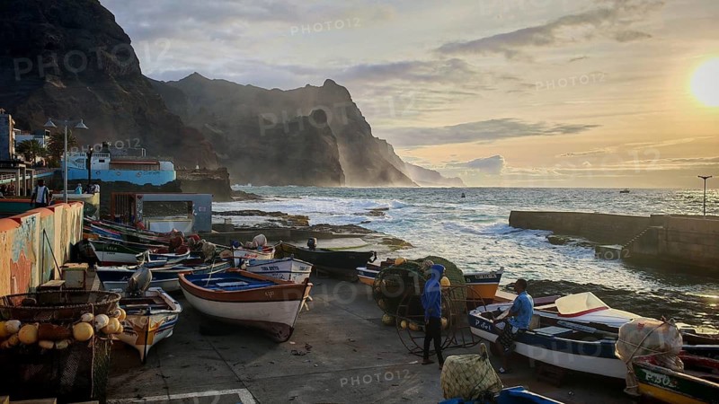 Fishing net and colorful boats on the coast with artistic walls, mural, graffiti and quiet evening mood at the fishing port, romantic, sunset, Ponta do Sol, Santo Antao, Cabo Verde, Cape Verde, Cape Verde